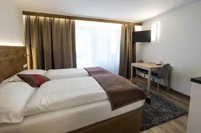 Ein Bett oder Betten in einem Zimmer der Unterkunft Apartments Butterfly Zermatt