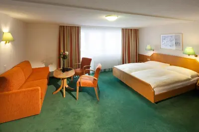 Ein Bett oder Betten in einem Zimmer der Unterkunft Hotel Cheminee
