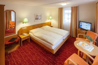 Ein Bett oder Betten in einem Zimmer der Unterkunft Hotel Cheminee