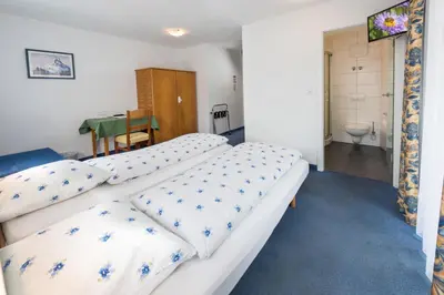 Ein Bett oder Betten in einem Zimmer der Unterkunft Hotel Rhodania