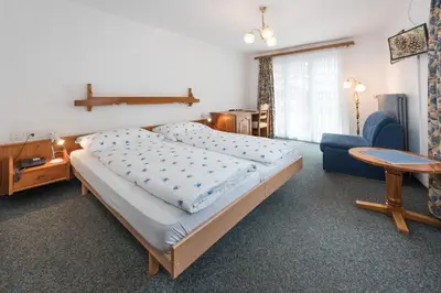 Ein Bett oder Betten in einem Zimmer der Unterkunft Hotel Rhodania