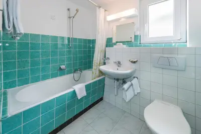 Ein Badezimmer in der Unterkunft Hotel Rhodania