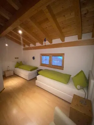Ein Bett oder Betten in einem Zimmer der Unterkunft Hotel Adonis