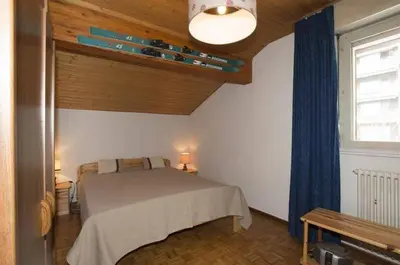Ein Bett oder Betten in einem Zimmer der Unterkunft Crans Montana Cervin 35