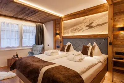 Ein Bett oder Betten in einem Zimmer der Unterkunft Silvana Mountain Hotel