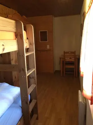 Ein Bett oder Betten in einem Zimmer der Unterkunft Le Central - Chambres d'hôte