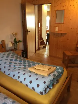 Ein Bett oder Betten in einem Zimmer der Unterkunft Le Central - Chambres d'hôte