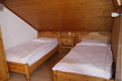 Ein Bett oder Betten in einem Zimmer der Unterkunft Hôtel - Petit-déjeuner Le Trift