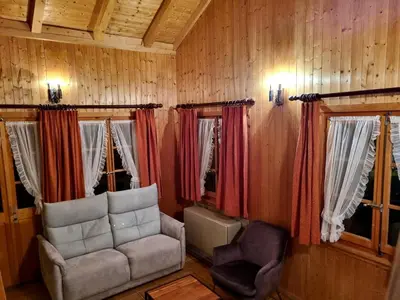 Ein Sitzbereich in der Unterkunft Hôtel - Petit-déjeuner Le Trift