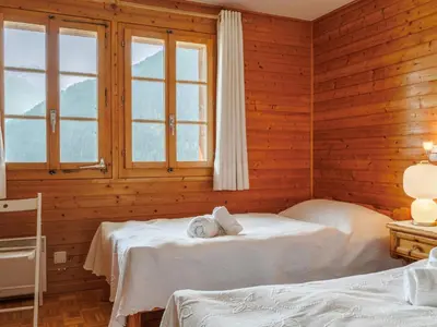 Ein Bett oder Betten in einem Zimmer der Unterkunft Chalet Les Clarines by Interhome