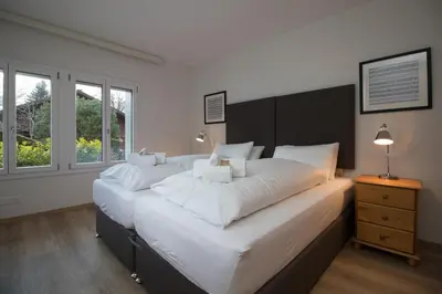 Ein Bett oder Betten in einem Zimmer der Unterkunft Hirschen Residence 2