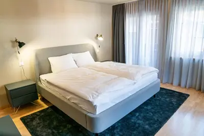 Ein Bett oder Betten in einem Zimmer der Unterkunft Vrony Apartments by Hotel Walliserhof Zermatt