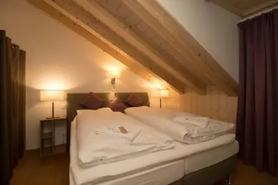 Ein Bett oder Betten in einem Zimmer der Unterkunft Chalet Belmont Penthouse
