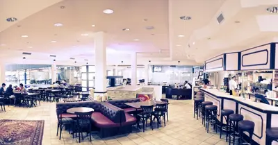 Ein Restaurant oder anderes Speiselokal in der Unterkunft Hotel Olympica