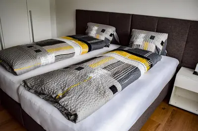 Ein Bett oder Betten in einem Zimmer der Unterkunft Apartments Alpenfirn Saas-Fee