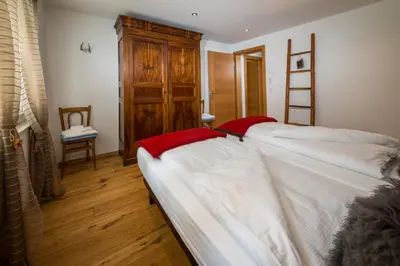 Ein Bett oder Betten in einem Zimmer der Unterkunft Casa Della Vita by Zermatt Premium Apartments