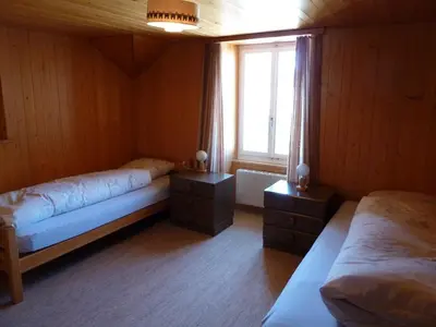 Ein Bett oder Betten in einem Zimmer der Unterkunft Berghaus Männlichen