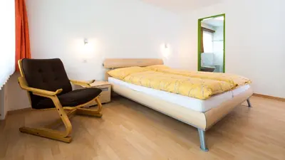 Ein Bett oder Betten in einem Zimmer der Unterkunft Apartments Atlas