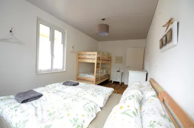 Ein Bett oder Betten in einem Zimmer der Unterkunft Interlaken Central 3