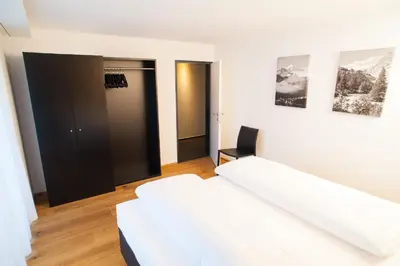 Ein Bett oder Betten in einem Zimmer der Unterkunft Elite Alpine Lodge - Apart & Breakfast