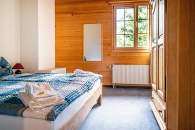 Ein Bett oder Betten in einem Zimmer der Unterkunft Hotel Gletscherblick Grindelwald