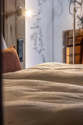 Ein Bett oder Betten in einem Zimmer der Unterkunft BaseCamp Hotel
