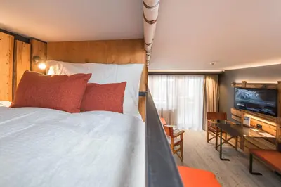 Ein Bett oder Betten in einem Zimmer der Unterkunft BaseCamp Hotel