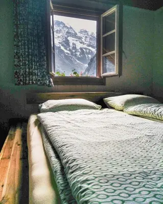 Ein Bett oder Betten in einem Zimmer der Unterkunft Mountain Hostel Gimmelwald