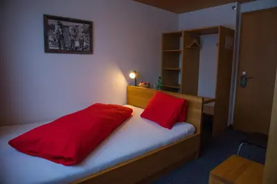 Ein Bett oder Betten in einem Zimmer der Unterkunft Hotel Wetterhorn