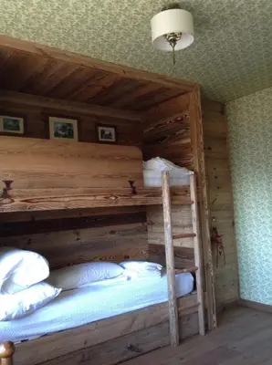 Ein Bett oder Betten in einem Zimmer der Unterkunft appartamento Melezes