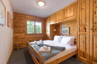 Ein Bett oder Betten in einem Zimmer der Unterkunft Aeolus MOUNTAIN & QUIET chalet 12 pers by Alpvision Résidences