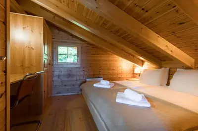 Ein Bett oder Betten in einem Zimmer der Unterkunft Aeolus MOUNTAIN & QUIET chalet 12 pers by Alpvision Résidences