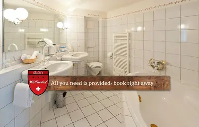 Ein Badezimmer in der Unterkunft Hotel Walliserhof - The Dom Collection