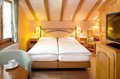 Ein Bett oder Betten in einem Zimmer der Unterkunft Hotel Romantica