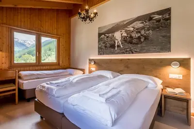 Ein Bett oder Betten in einem Zimmer der Unterkunft Hotel Walser