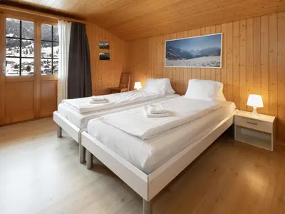Ein Bett oder Betten in einem Zimmer der Unterkunft Holiday Home Chalet Reinhysi by Interhome
