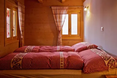 Ein Bett oder Betten in einem Zimmer der Unterkunft Appartement sous les combles - Chalet La Biolle - Vercorin