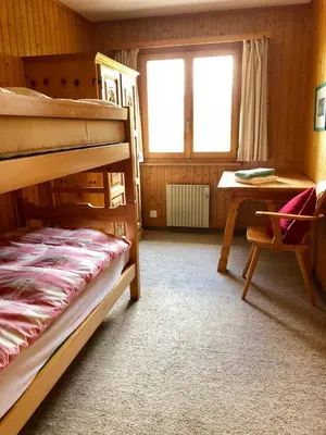 Ein Bett oder Betten in einem Zimmer der Unterkunft Alpenchalet Trutmundi undri