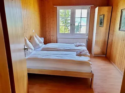 Ein Bett oder Betten in einem Zimmer der Unterkunft B & B Brienz