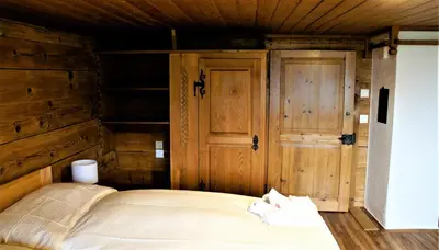 Ein Bett oder Betten in einem Zimmer der Unterkunft B & B Brienz