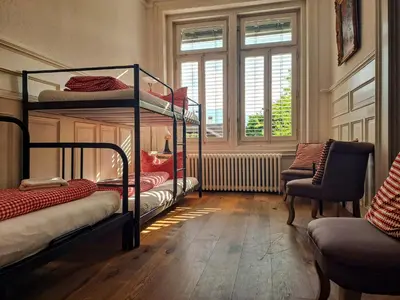 Ein Bett oder Betten in einem Zimmer der Unterkunft Adventure Hostel Interlaken