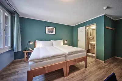 Ein Bett oder Betten in einem Zimmer der Unterkunft 5th Floor Basic Rooms - shared bathrooms