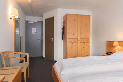 Ein Bett oder Betten in einem Zimmer der Unterkunft Jungfrau Lodge, Annex Crystal