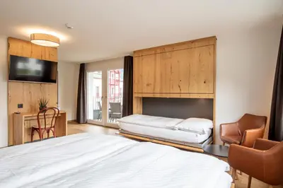 Ein Bett oder Betten in einem Zimmer der Unterkunft Hotel Meiringen