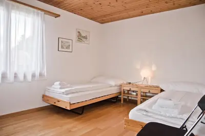 Ein Bett oder Betten in einem Zimmer der Unterkunft Apartment Aare 3.5 by GriwaRent AG