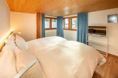 Ein Bett oder Betten in einem Zimmer der Unterkunft Haus Genepy