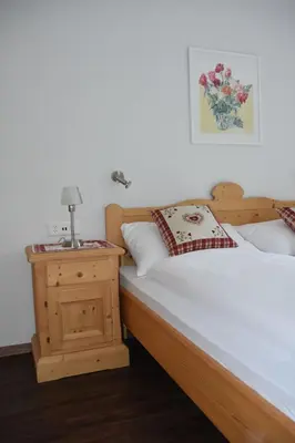 Ein Bett oder Betten in einem Zimmer der Unterkunft FERIENWOHNUNGEN Chalet Hohturnen