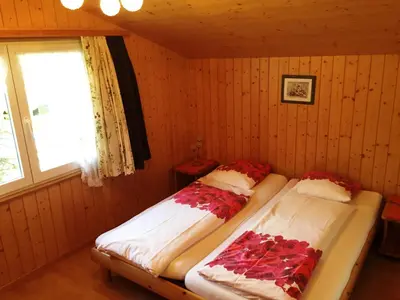 Ein Bett oder Betten in einem Zimmer der Unterkunft Alpen Chalet