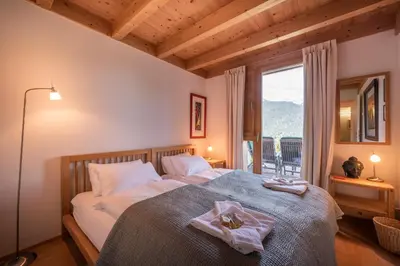 Ein Bett oder Betten in einem Zimmer der Unterkunft Chalet Roossi 2