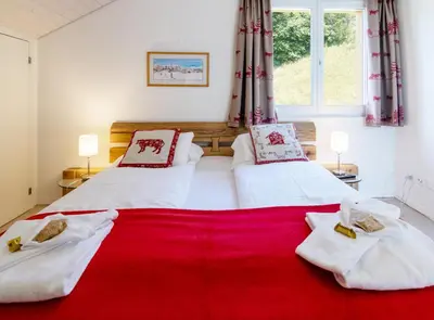 Ein Bett oder Betten in einem Zimmer der Unterkunft Chalet Hannegg Penthouse